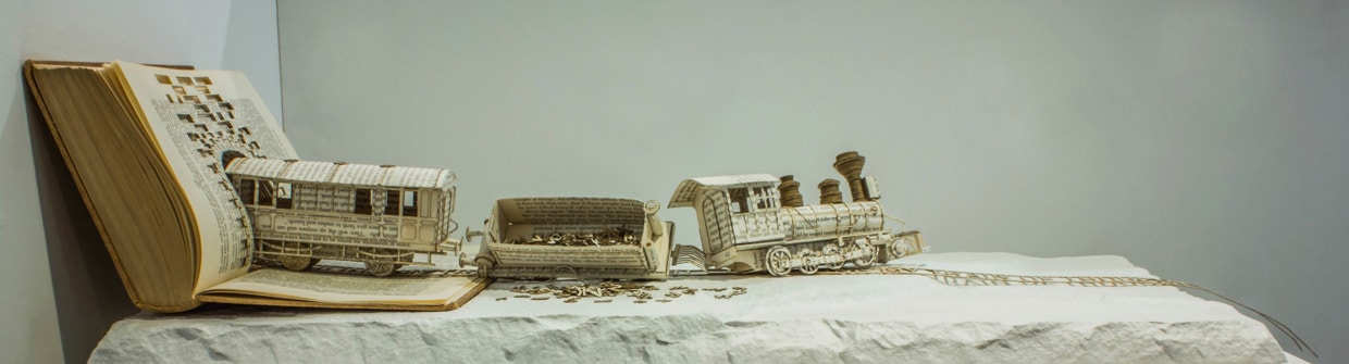 Book Sculpture Illustrates OCD With A Derailed Typography Train